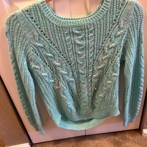 I’m selling a lime green sweater. It for the fall or winter